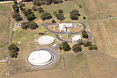 Aerial view of water treatment plant surrounded by green trees and fields,Elliminyt,Australia