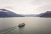 Aerial view of single ferry boat crossing Lago di Como,Cadenabbia,Italy
