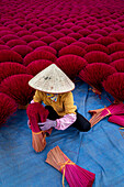 Aerial view of vibrant incense field with workers in conical hats,Huyen Ung Hoa,Vietnam