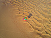 Aerial view of an hot-air-balloon flying in the Murqquab desert in Dubai,U.A.E