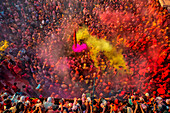 Nandgaon,India - 01 March 2023: Aerial view of people celebrating the holy colour festival at Shri And Baba Temple,Uttar Pradesh,India