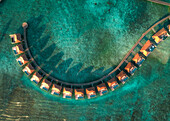 Aerial view of a beautiful luxury resort at sunset on Alifu Dhaalu Atoll in North Central Province in the middle of the Ocean,Alif ALif,Maldives
