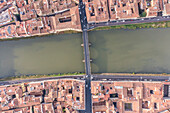 Aerial view of Santa Trinita bridge crossing the Arno river in Florence downtown,Tuscany,Italy