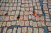 Barga,Bangladesh - 17 April 2022: Aerial view of Women at work on the preparation of natural fabric,Barga,Rajshahi,Bangladesh