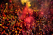 Nandgaon,India - 01 March 2023: Aerial view of people celebrating the holy colour festival at Shri And Baba Temple,Uttar Pradesh,India