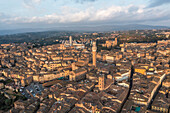 Aerial view of Siena old town with Piazza del Campo main square at sunset,Tuscany,Italy