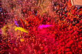 Nandgaon,India - 01 March 2023: Aerial view of people celebrating the holy colour festival at Shri And Baba Temple,Uttar Pradesh,India
