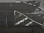 Aerial view of urban layout with creative patterns and lines in a parking lot,Serravalle Scrivia,Italia