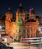 Aerial view of illuminated queen victoria square and city hall at night with traffic and street lights,Hull,United Kingdom