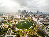 Aerial view above of MacArthur Park with downtown Los Angeles at the background,USA