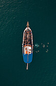 Aerial view of people jumping off the boat into the Mediterranean Sea in La Valletta,Malta