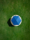 Aerial view of a unique circular structure with a blue roof surrounded by green grass,Fort Worth,United States of America