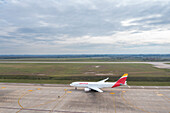 Canelones,Uruguay - 08 June 2023: Aerial view of Aeropuerto de Carrasco with airplanes on the runway under a cloudy sky,Canelones,Uruguay