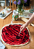 Prepare Easter plait with berry jam