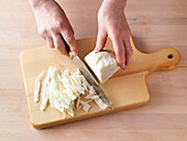 Cut white cabbage into strips