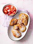 Curd cheese cakes with strawberry and rhubarb compote