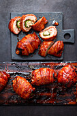 Stuffed chicken thighs wrapped in bacon from the grill