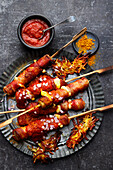 Grilled currywurst with fried potatoes
