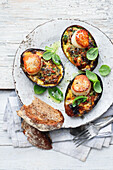 Tasty avocado bites with egg and bacon glaze and scallops