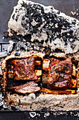 Hybrid beef ribs grilled in a salt crust