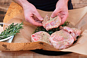 Prepare meat thighs in butcher paper for the barbecue