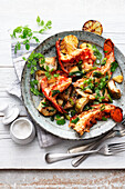 Grilled butter cooked lobster with artichokes and lemon