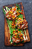 Grilled pork loin steaks with tomato and mango salsa