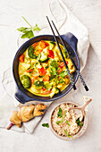 Chicken and coconut curry with broccoli and peppers