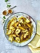 Baked potatoes Aloo Gobi style with spicy cauliflower