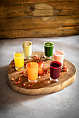 Various fruit and vegetable shots on a wooden board