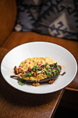 Stuffed aubergine with curry coconut sauce