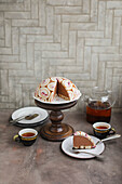 Chocolate cheesecake dome cake with sponge rolls