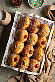 Doughnuts with jam, chocolate cream and vanilla cream