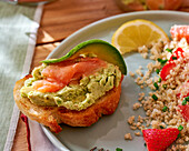 Quinoa salad with strawberries, pomelo and salmon and avocado terrine