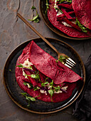 Beetroot crêpes with almond cheese