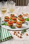 Baci di Dama with chopped pistachios and aromatic herbs