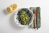 Chitarra spaghetti with cacio pepe and broad beans