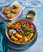 Falafel salad with cucumber, tomato and red onion