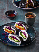 Japanese onigiri with avocado. Red cabbage, spinach and sweet potato
