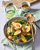 Potato salad with spinach and hard-boiled egg