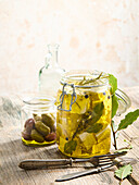 Marinated feta with rosemary and bay leaf in olive oil