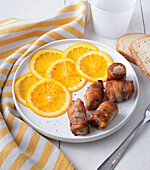 Pork wrapped in plum and bacon