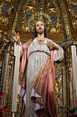 Marbella, Spain. Statue of Jesus on a gilded altar inside an ancient Spanish church.