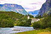 Skjolden, Norway. Sognefjord, white steeple church in village.