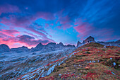 Tiziano alpine hut in the Marmarole mountain range during a vivid sunrise. Belluno, Veneto, Italy.