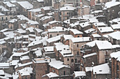 The medieval village of Pacentro under heavy snowfall with snow covered house, Pacentro municipality, Maiella national park, L’aquila province, Abruzzo, Italy