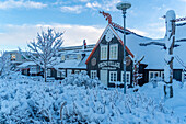 View of snow covered Fjorukrain Viking Restaurant and museum in winter, Hafnarfjorour, Iceland