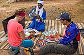 Preparation of the lunch of a group of bike hikers near the dunes of Tindouf, Draa River valley, Province of Zagora, Region Draa-Tafilalet, Morocco