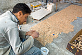 Assembling a zellige panel, pottery area, Fes, Morocco