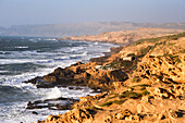 Fishermen's huts perched upon cliffs around Tamri on Atlantic Coast, between Agadir and Essaouira, Morocco